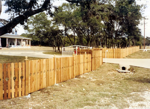 2 rail 4 foot spaced wood picket property fence
