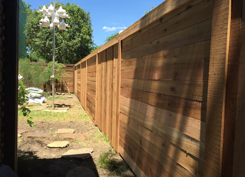 alternating vertical and horizontal picket cedar fence