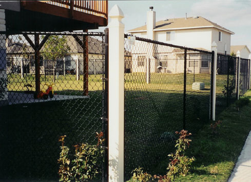 black chain link fence with white posts