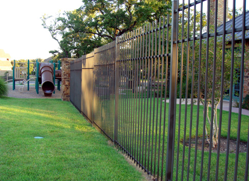 brown metal fence around playground