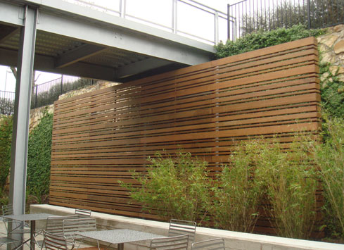 horizontal-stained-fence-under-walkway-bridge