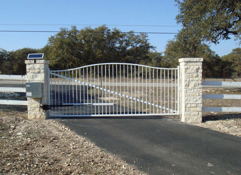 white metal swing out driveway gate solar powered