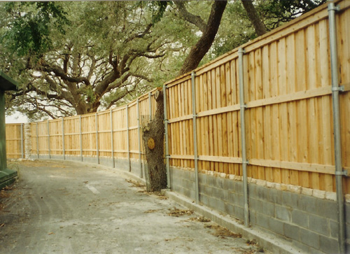 wood security fence metal posts concrete block wall