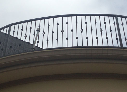 wrought iron handrail on second floor balcony