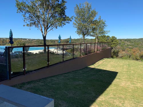 Pipe Rail Fence with Glass Panel Around Pool